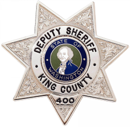 Seven Point Star Badge with Circular Panel