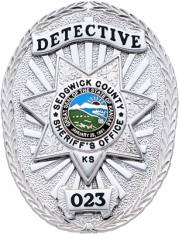 Oval badge with seven point star S577AD