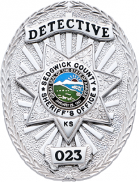 Oval badge with seven point star S577AD